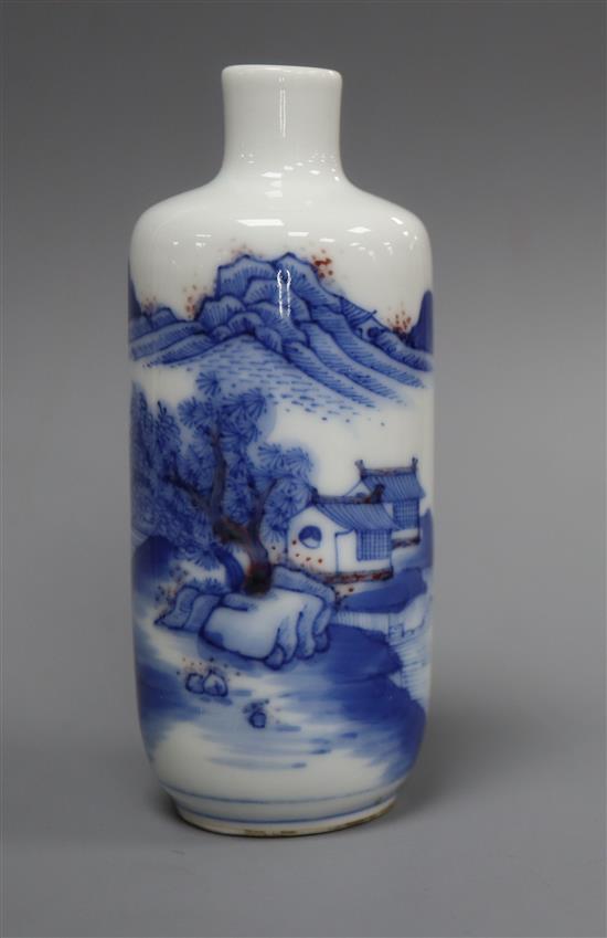 A Chinese underglaze blue and copper red landscape snuff bottle